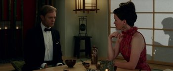 Movie still from “Down with Love” (2003), directed by Peyton Reed – A man and a woman sitting at a dining room table; Medium shot, Over the shoulder angle