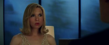 Movie still from “Down with Love” (2003), directed by Peyton Reed – A beautiful blonde woman sitting in front of a window; Close Up shot, Over the shoulder angle