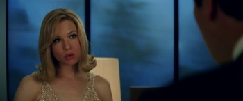 Movie still from “Down with Love” (2003), directed by Peyton Reed – A woman sitting in front of a window; Close Up shot, Over the shoulder angle