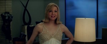 Movie still from “Down with Love” (2003), directed by Peyton Reed – A beautiful blonde woman in a white dress; Medium shot, Over the shoulder angle