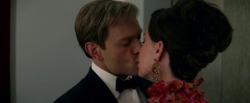 Movie still from “Down with Love” (2003), directed by Peyton Reed – A man and a woman kissing each other in formal wear; Close Up shot, High angle
