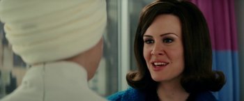 Movie still from “Down with Love” (2003), directed by Peyton Reed – A woman in a blue sweater talking to another woman in a white turban; Close Up shot, Over the shoulder angle