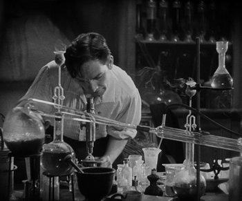Movie still from “Dr. Jekyll and Mr. Hyde” (1931), directed by Rouben Mamoulian – A man working in an old fashioned laboratory; Medium shot, Low angle
