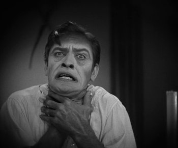 Movie still from “Dr. Jekyll and Mr. Hyde” (1931), directed by Rouben Mamoulian – A man with a cigarette in his mouth; Close Up shot, Low angle