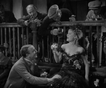 Movie still from “Dr. Jekyll and Mr. Hyde” (1931), directed by Rouben Mamoulian – A man and a woman sitting on a bench; Medium shot, High angle