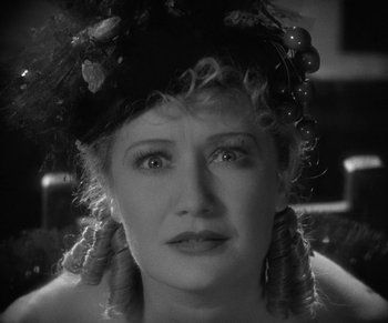 Movie still from “Dr. Jekyll and Mr. Hyde” (1931), directed by Rouben Mamoulian – An older woman wearing a hat and looking at the camera; Close Up shot, High angle