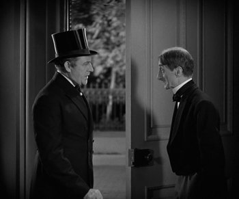 Movie still from “Dr. Jekyll and Mr. Hyde” (1931), directed by Rouben Mamoulian – Two men standing in front of a door; Medium shot, Over the shoulder angle