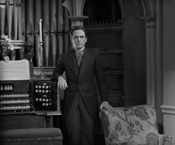 Movie still from “Dr. Jekyll and Mr. Hyde” (1931), directed by Rouben Mamoulian – A man standing in front of an organ; Medium shot, Low angle