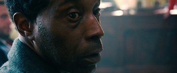 Movie still from “Don't Look Up” (2021), directed by Adam McKay – A man's face in a dimly - lit room; Extreme Close Up shot, Over the shoulder angle