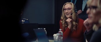 Movie still from “Don't Look Up” (2021), directed by Adam McKay – A woman sitting in front of a laptop computer; Medium shot, Over the shoulder angle