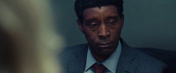 Movie still from “Don't Look Up” (2021), directed by Adam McKay – A person wearing a suit and tie; Close Up shot, Over the shoulder angle