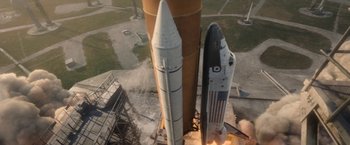 Movie still from “Don't Look Up” (2021), directed by Adam McKay – An aerial view of a space shuttle on a launch pad; Extreme Wide shot, Overhead angle