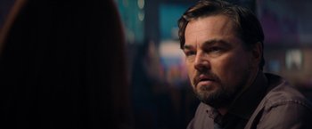 Movie still from “Don't Look Up” (2021), directed by Adam McKay – A person wearing a suit and tie; Close Up shot, Over the shoulder angle