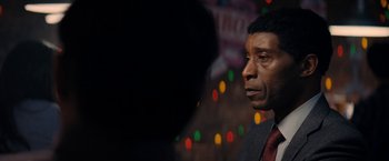 Movie still from “Don't Look Up” (2021), directed by Adam McKay – A person in a room with lights in the background; Close Up shot, Over the shoulder angle