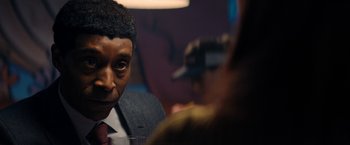 Movie still from “Don't Look Up” (2021), directed by Adam McKay – A person wearing a suit and tie; Close Up shot, Over the shoulder angle