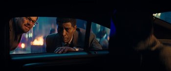 Movie still from “Don't Look Up” (2021), directed by Adam McKay – A man in a suit looking out of a car window at night; Close Up shot, Over the shoulder angle