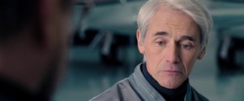 Movie still from “Don't Look Up” (2021), directed by Adam McKay – An older man with white hair looking at the camera; Close Up shot, Over the shoulder angle