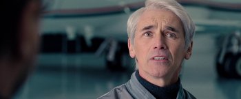 Movie still from “Don't Look Up” (2021), directed by Adam McKay – An older man with white hair looking at the camera; Close Up shot, Over the shoulder angle