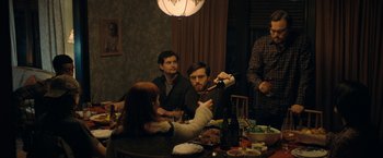 Movie still from “Don't Look Up” (2021), directed by Adam McKay – A group of people sitting at a table drinking wine; Medium shot, Over the shoulder angle