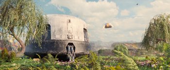 Movie still from “Don't Look Up” (2021), directed by Adam McKay – An abandoned space ship in the middle of a lush green field; Extreme Wide shot, Low angle