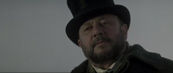 Movie still from “Dracula” (1979), directed by John Badham – A person wearing a top hat; Close Up shot, Low angle