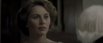 Movie still from “Dracula” (1979), directed by John Badham – A person wearing a necklace; Close Up shot, Over the shoulder angle