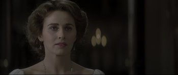 Movie still from “Dracula” (1979), directed by John Badham – A beautiful woman with long dark hair wearing a white dress; Close Up shot, Over the shoulder angle