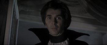 Movie still from “Dracula” (1979), directed by John Badham – A person wearing a cape; Close Up shot, Low angle