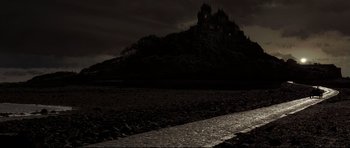 Movie still from “Dracula” (1979), directed by John Badham – A dark picture of a castle on a hill; Extreme Wide shot, High angle