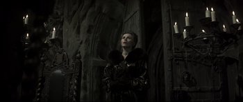 Movie still from “Dracula” (1979), directed by John Badham – A woman dressed in a black outfit with a fur collar; Medium shot, Low angle