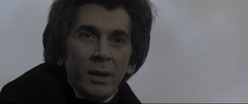 Movie still from “Dracula” (1979), directed by John Badham – A man's face in black and white; Close Up shot, Over the shoulder angle