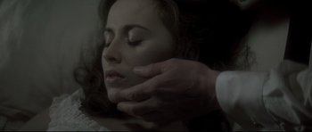 Movie still from “Dracula” (1979), directed by John Badham – A person touching the face of another person; Close Up shot, Overhead angle