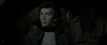 Movie still from “Dracula” (1979), directed by John Badham – A person holding an umbrella; Close Up shot, Over the shoulder angle
