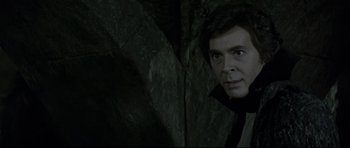 Movie still from “Dracula” (1979), directed by John Badham – A person in a dark room; Close Up shot, Over the shoulder angle