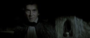 Movie still from “Dracula” (1979), directed by John Badham – A person wearing a suit and tie; Close Up shot, Low angle