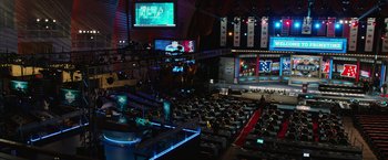 Movie still from “Draft Day” (2014), directed by Ivan Reitman – An audience is sitting in the middle of an auditorium; Extreme Wide shot, High angle