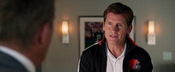 Movie still from “Draft Day” (2014), directed by Ivan Reitman – A person wearing a jacket; Close Up shot, Over the shoulder angle
