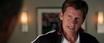 Movie still from “Draft Day” (2014), directed by Ivan Reitman – A person wearing a jacket; Close Up shot, Over the shoulder angle