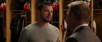 Movie still from “Draft Day” (2014), directed by Ivan Reitman – A person talking to another person; Close Up shot, Over the shoulder angle