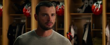 Movie still from “Draft Day” (2014), directed by Ivan Reitman – A person wearing a sweater; Close Up shot, Over the shoulder angle