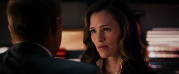 Movie still from “Draft Day” (2014), directed by Ivan Reitman – A person sitting in front of another person; Close Up shot, Over the shoulder angle