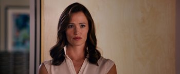 Movie still from “Draft Day” (2014), directed by Ivan Reitman – A person wearing a white shirt; Close Up shot, Over the shoulder angle