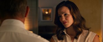 Movie still from “Draft Day” (2014), directed by Ivan Reitman – A beautiful woman with long brown hair wearing a white shirt; Close Up shot, Over the shoulder angle