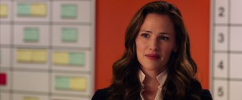 Movie still from “Draft Day” (2014), directed by Ivan Reitman – A person with long hair; Close Up shot, Over the shoulder angle