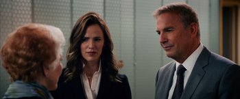 Movie still from “Draft Day” (2014), directed by Ivan Reitman – A man and a woman standing next to each other; Close Up shot, Over the shoulder angle