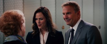 Movie still from “Draft Day” (2014), directed by Ivan Reitman – A man and a woman standing next to each other; Close Up shot, Over the shoulder angle