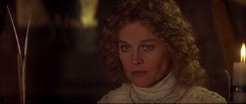 Movie still from “DragonHeart” (1996), directed by Rob Cohen – A person with curly hair wearing a sweater; Close Up shot, Over the shoulder angle