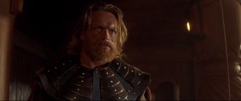 Movie still from “DragonHeart” (1996), directed by Rob Cohen – A person wearing armor; Close Up shot, Low angle