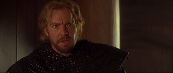 Movie still from “DragonHeart” (1996), directed by Rob Cohen – A person with a beard; Close Up shot, Over the shoulder angle