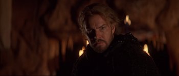 Movie still from “DragonHeart” (1996), directed by Rob Cohen – A person with a beard; Close Up shot, Over the shoulder angle